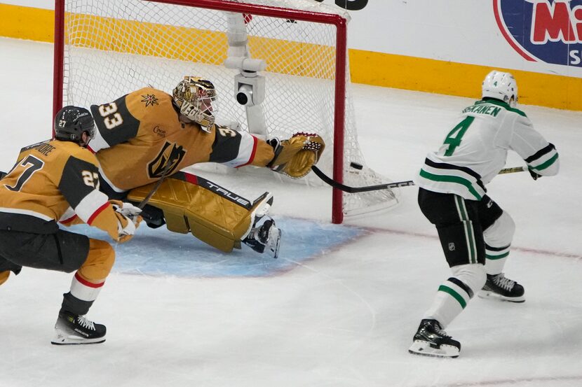 Dallas Stars defenseman Miro Heiskanen (4) attempts a shot on Vegas Golden Knights...