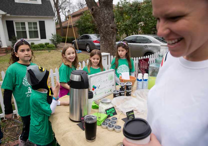 Hot chocolate from the Kids Luv Trees fundraiser put a smile on Shannon O’Brien’s face.