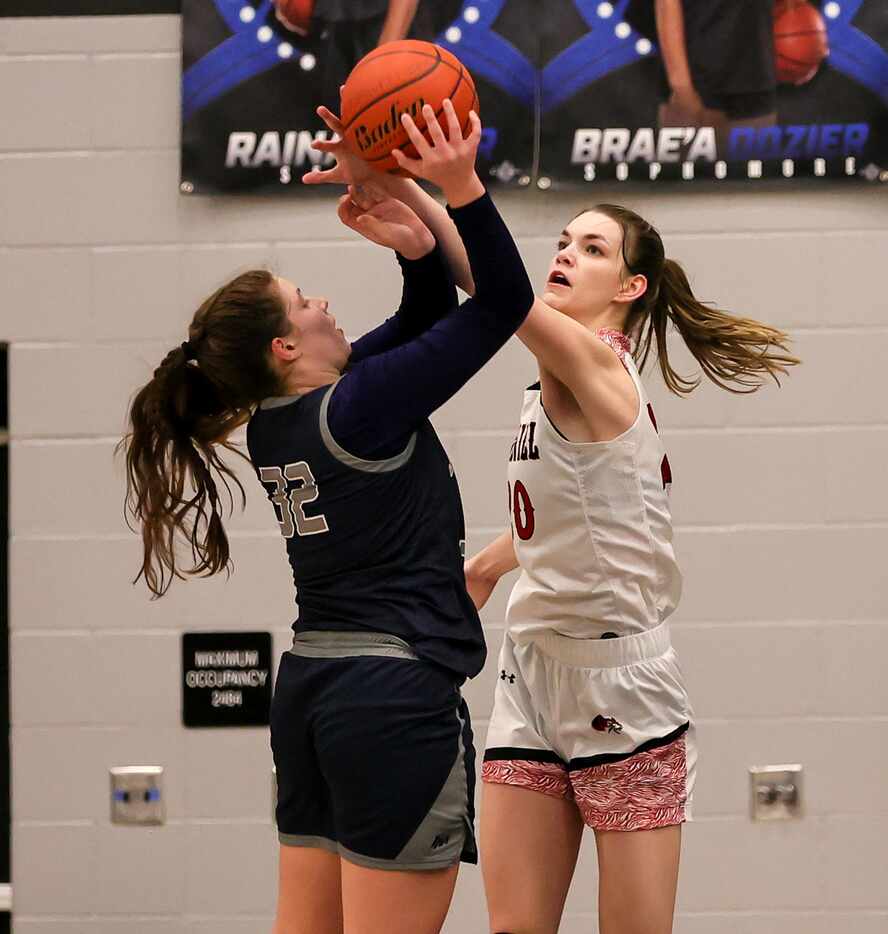 Flower Mound forward Maya Bujak (32) gets her shot blocked by Denton Braswell center Torie...