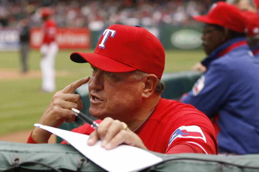 Texas Rangers Hitting coach Clint Hurdle (13) talks to a hitter on-deck against the Kansas...