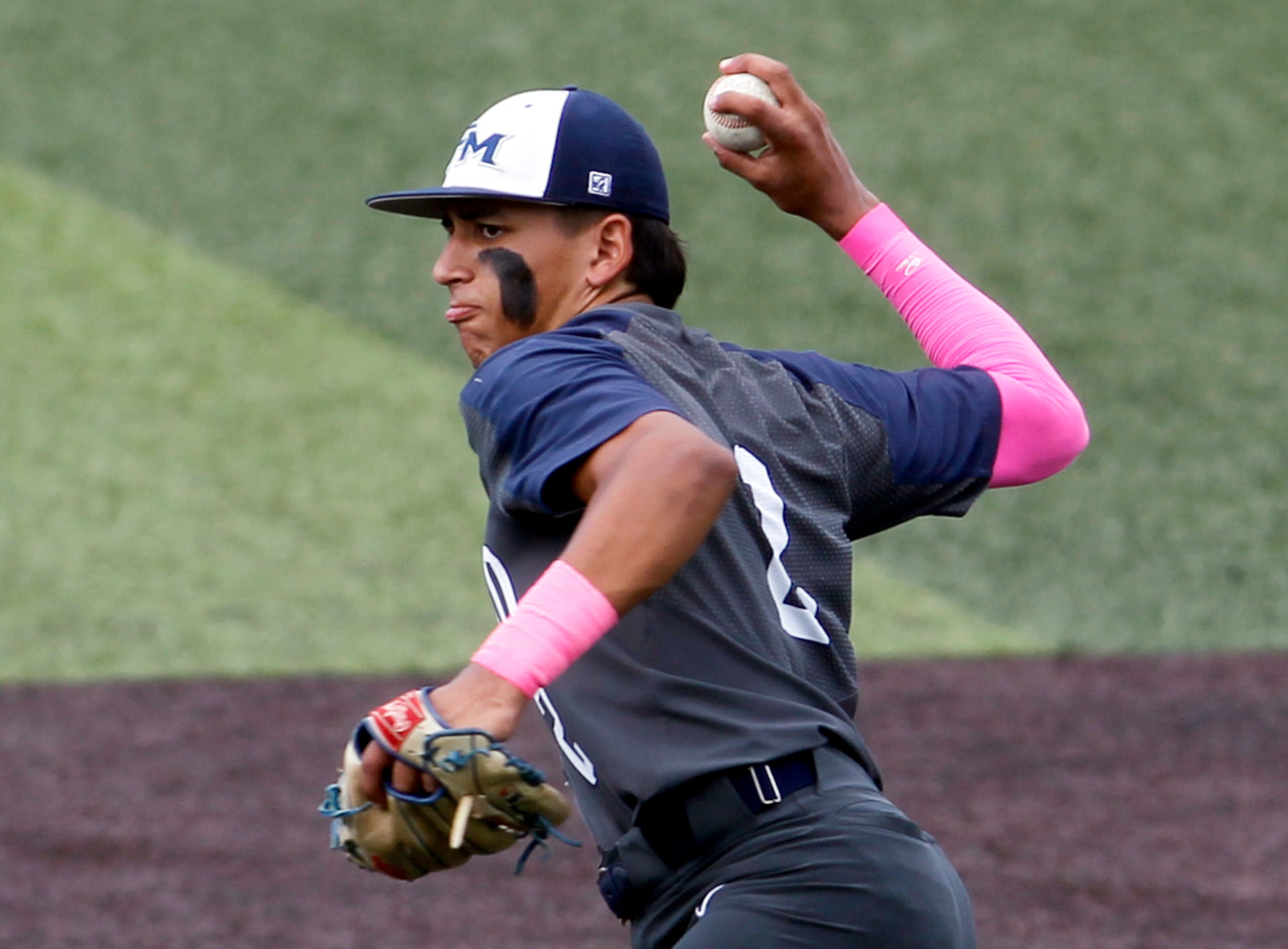 Flower Mound senior infielder Adrian Rodriguez (2) fires a relay throw to third base during...