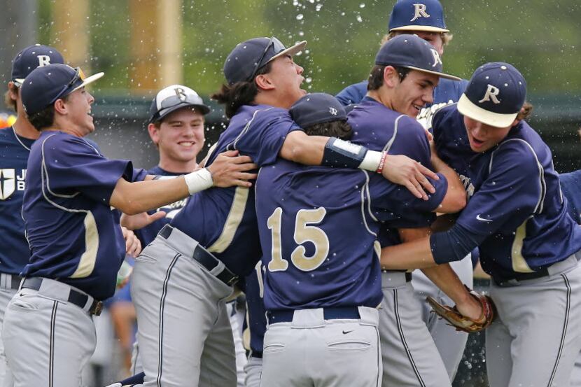 Jesuit’s closing pitcher Jacob Palisch (17) is mobbed by teammates after they defeated...