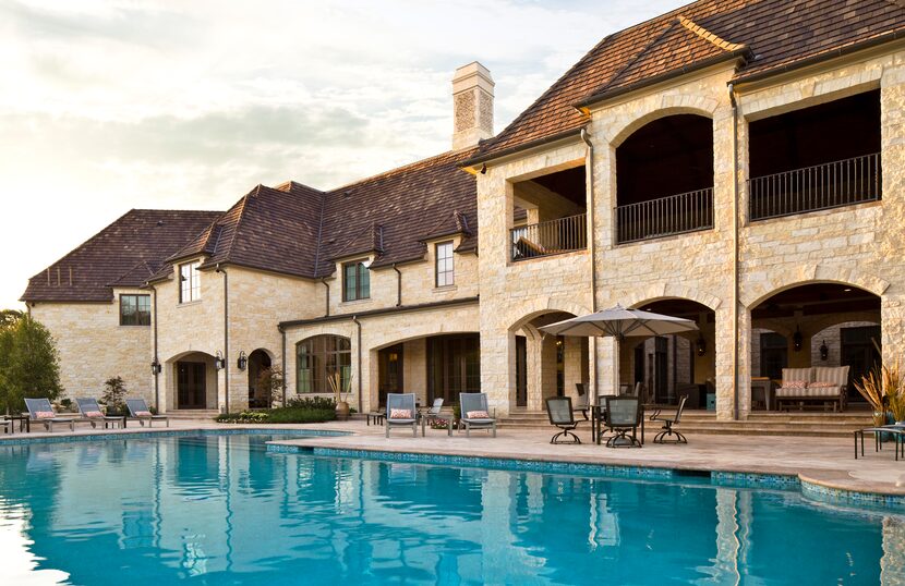 The outdoor pool area includes a fire pit and pool house. 