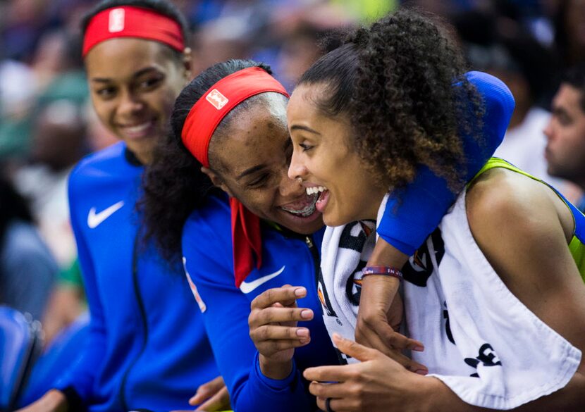 Dallas Wings forward Kayla Thornton (6) hugs Dallas Wings guard Skylar Diggins-Smith (4) on...