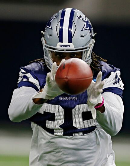 Dallas Cowboys cornerback Brandon Carr catches the ball during practice at The Star in...
