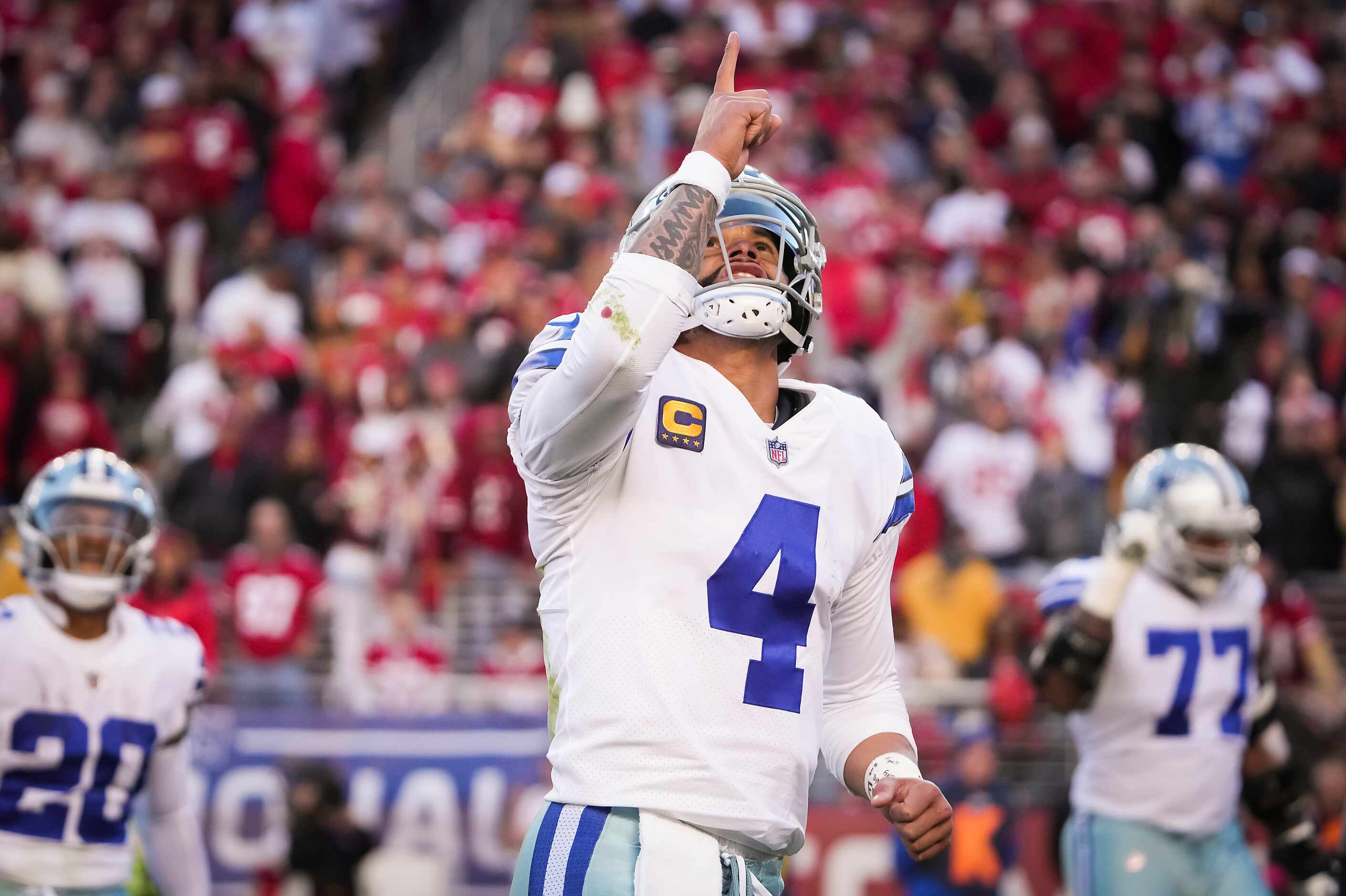 Dallas Cowboys quarterback Dak Prescott (4) celebrates after throwing a touchdown pass to...