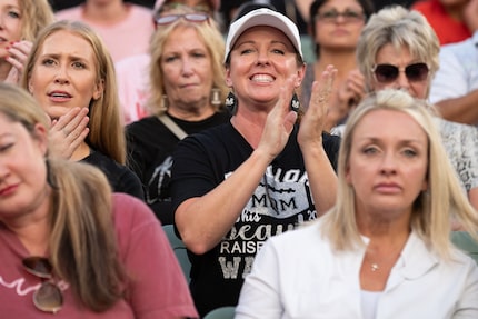 Amy Wager cheers for Arlington Martin versus South Grand Prairie during a football game at...