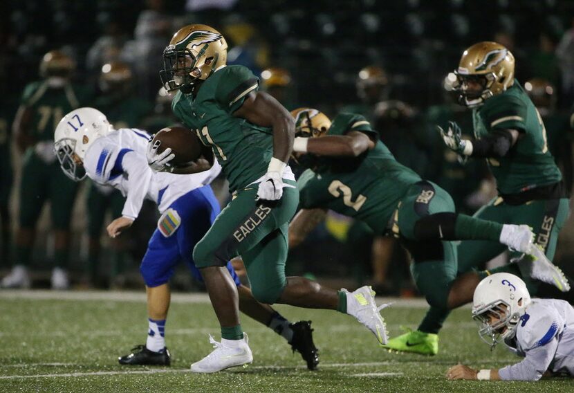 DeSoto wide receiver KD Nixon (11) returns a kickoff for a touchdown to make the score 20-14...