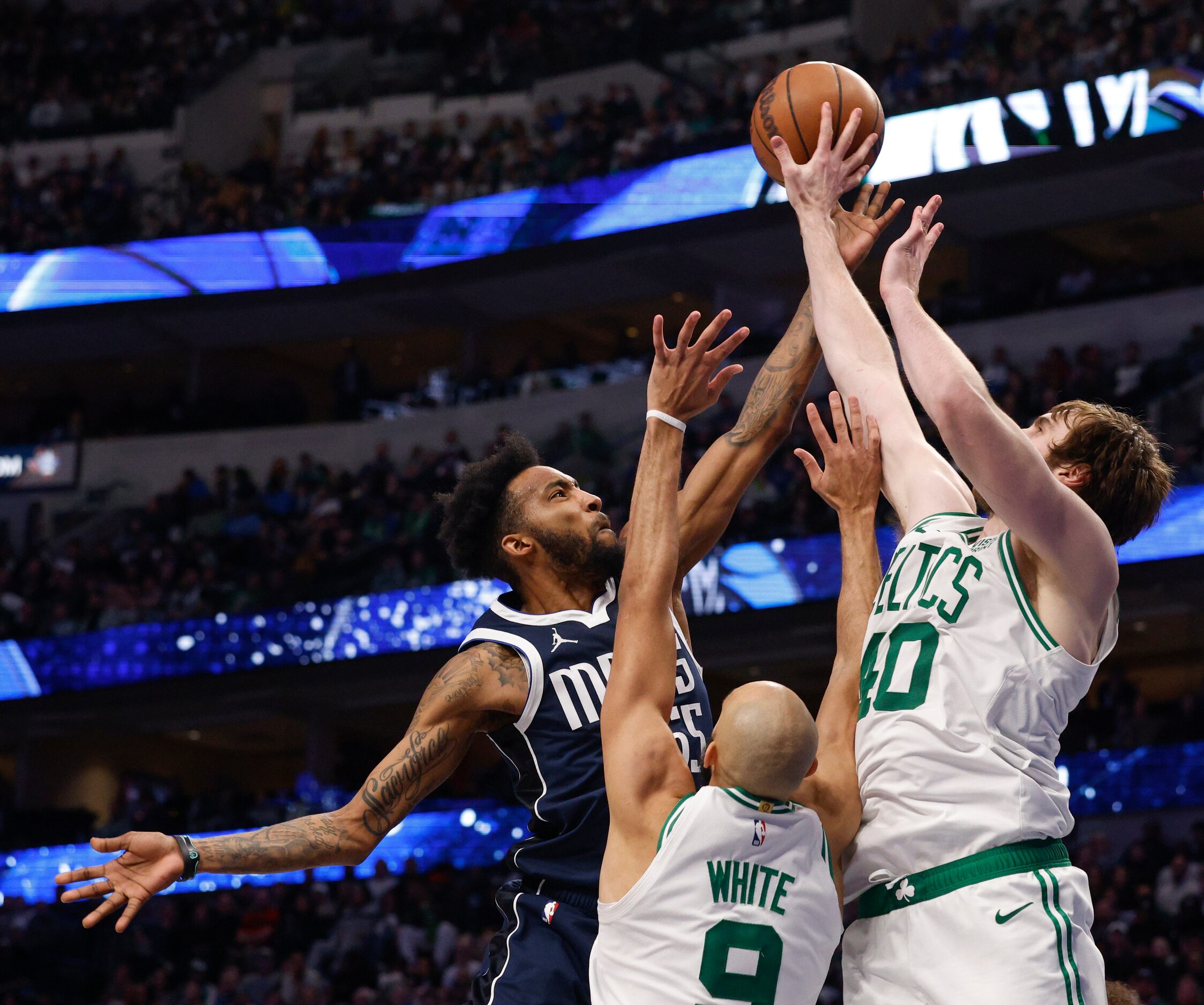 Boston Celtics center Luke Kornet (40) blocks a shot attempt from Dallas Mavericks forward...