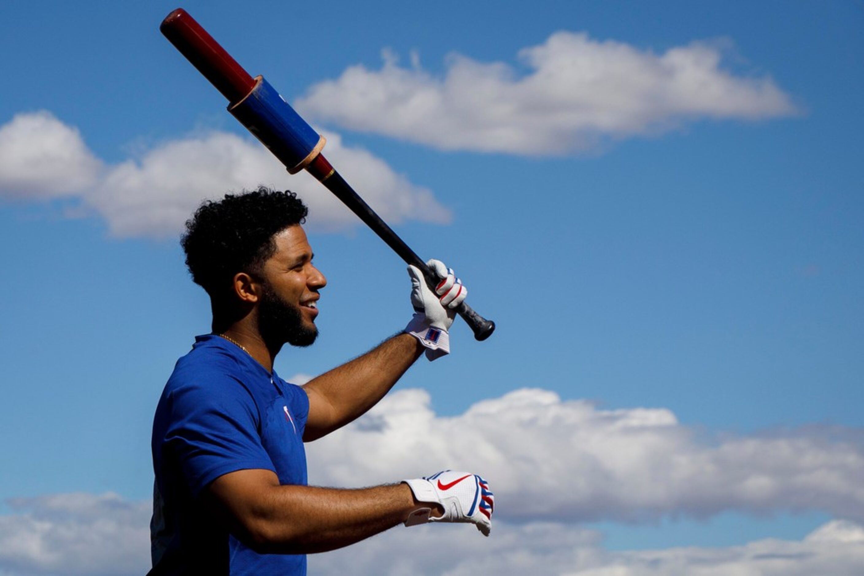 Texas Rangers shortstop Elvis Andrus loosens up before taking batting practice during a...