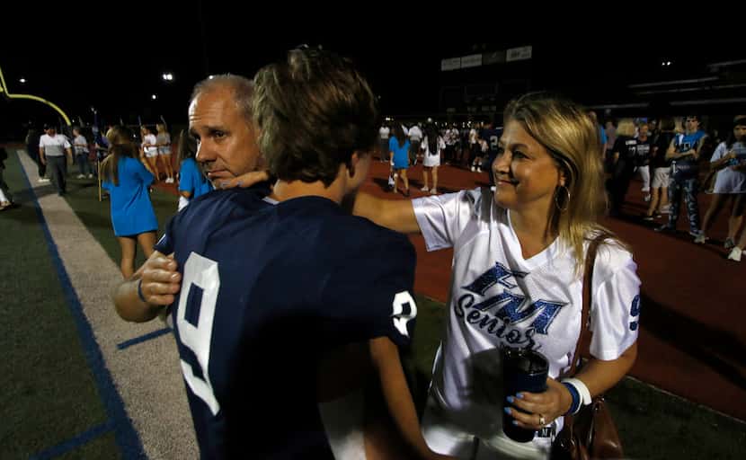 Mark and Beth Winters were quick to offer a consoling hug for their son, senior receiver...