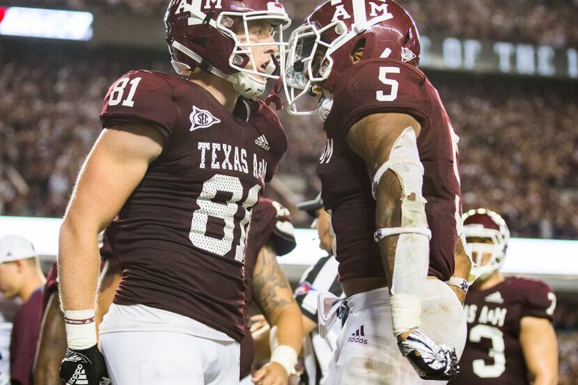 Texas A&M Aggies tight end Jace Sternberger (81) celebrates with running back Trayveon...