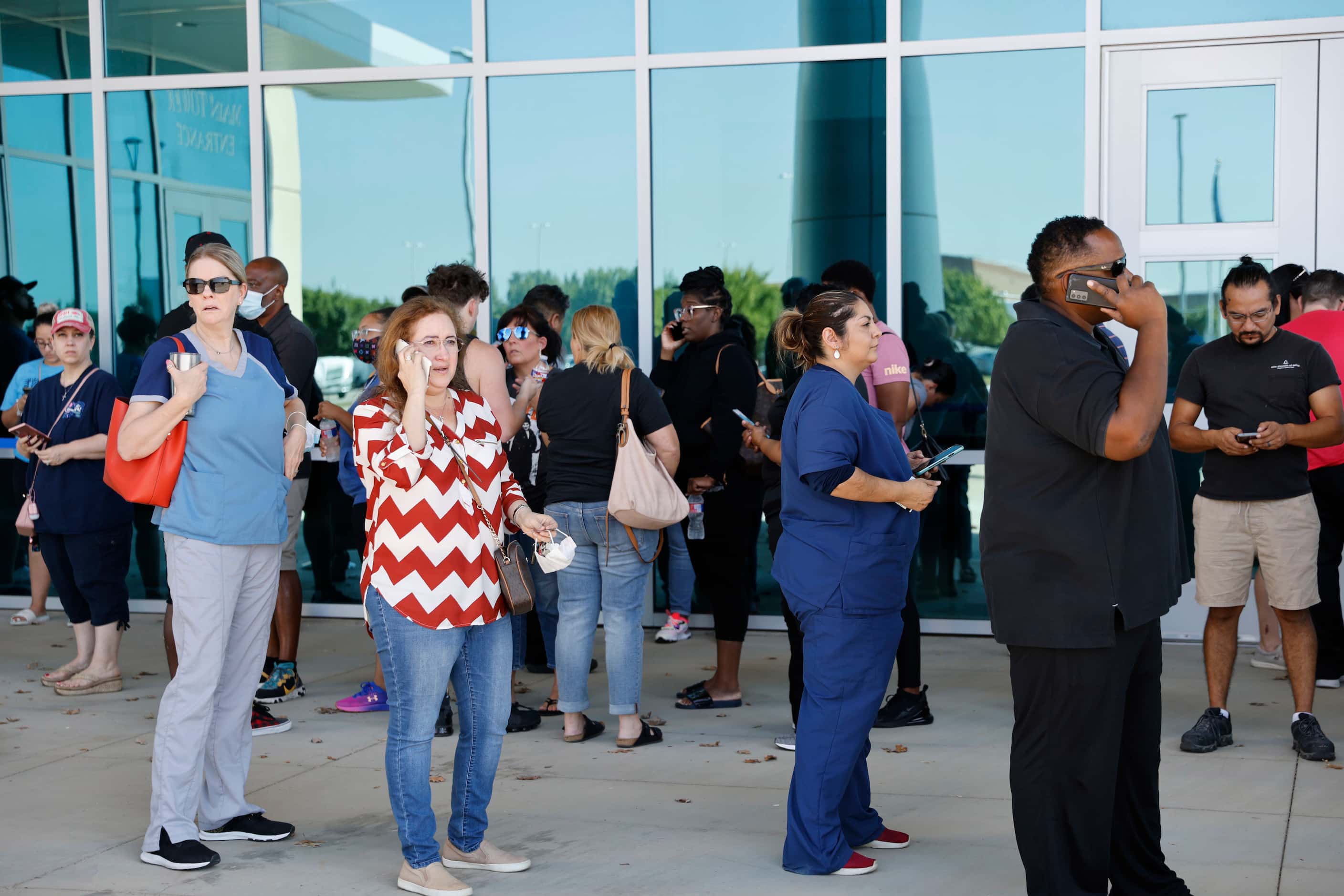 Parents of Timberview High School students wait outside of the Mansfield ISD Center for The...