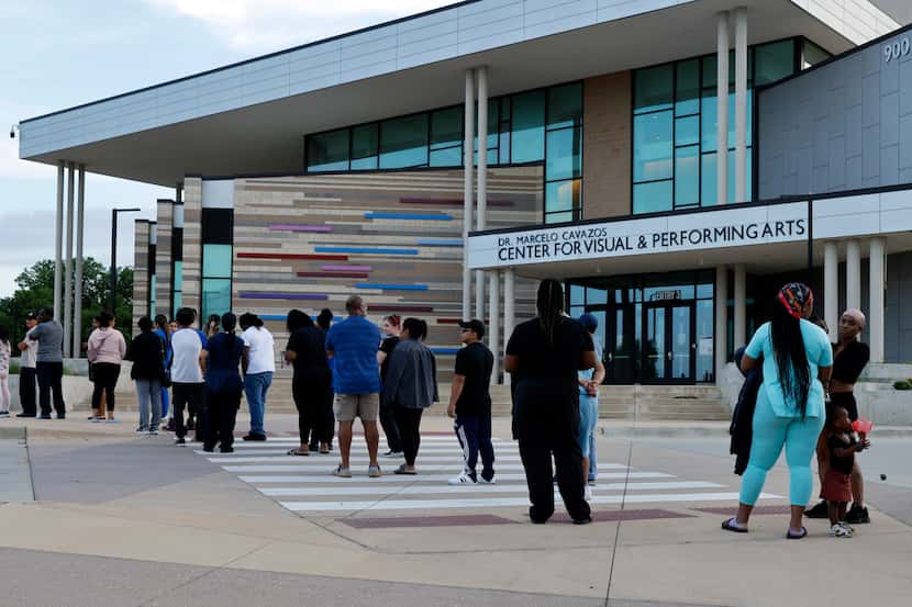 Family members of Bowie High School students wait outside Arlington ISD’s Center for Visual...