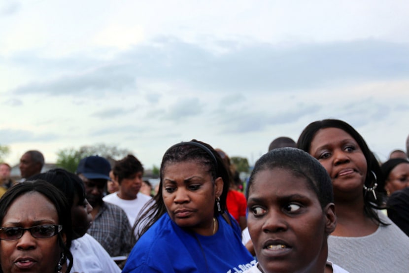 Residents and former residents of West Dallas gather to organize a survey about their...