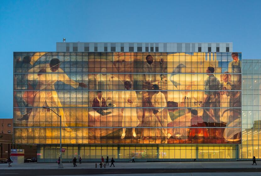 This wall facade along the side of Harlem Hospital replicates three panels from a Works...
