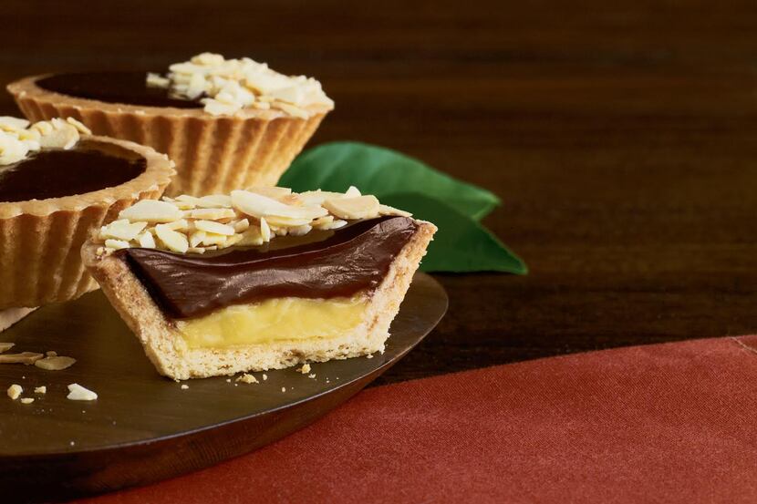 La Madeleine's chocolate-almond tart is made with vanilla pastry filling topped with...