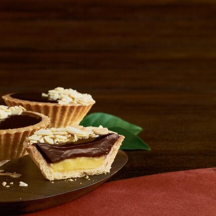 La Madeleine's chocolate-almond tart is made with vanilla pastry filling topped with...