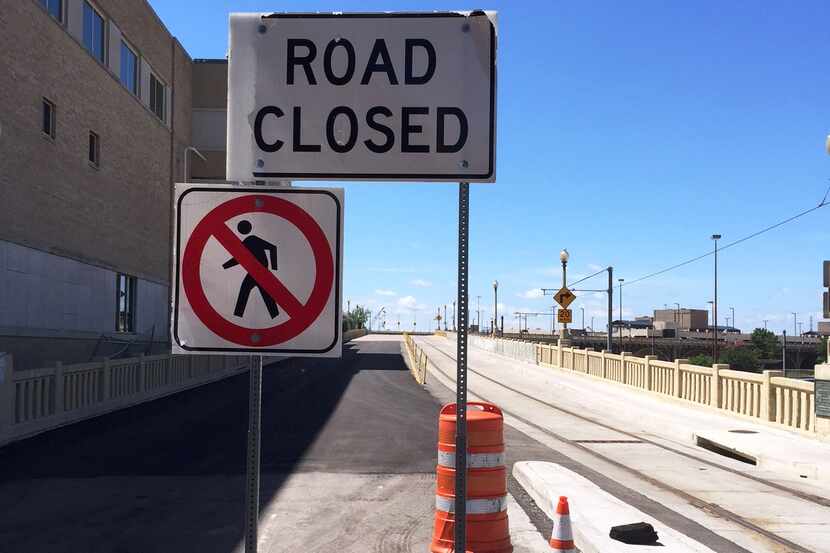  These signs at the northern end of the Houston Street Viaduct will go away when the city...
