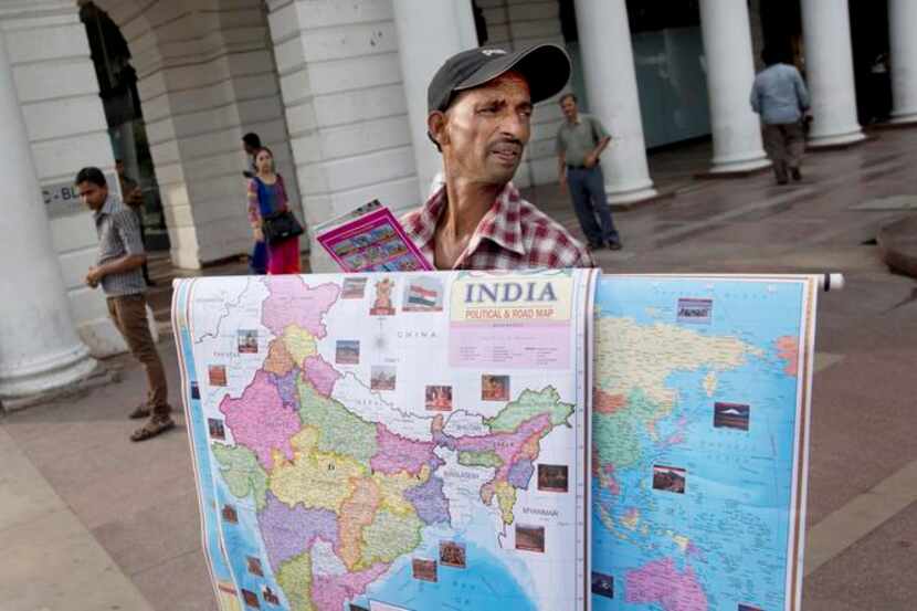 
A street vendor sells political maps in India, where police have been alerted to a...