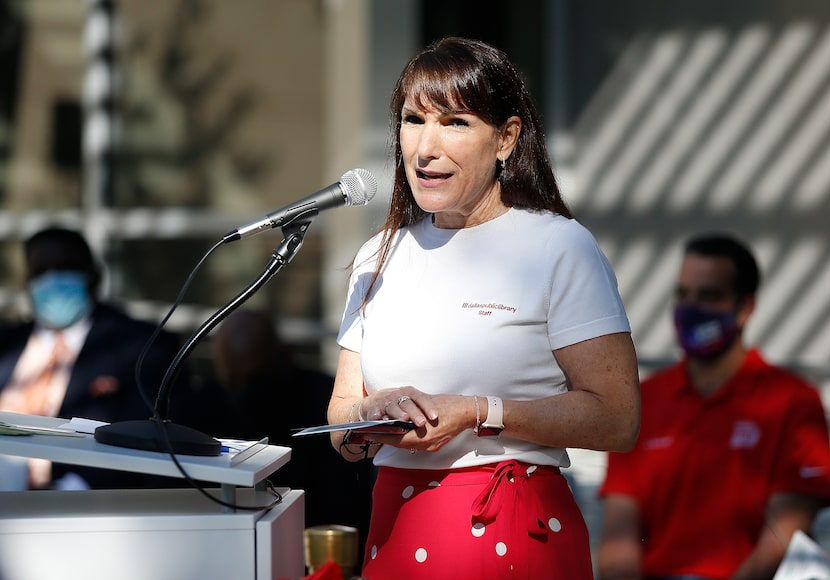 Jo Giudice, the city's library director, spoke before the ribbon cutting at the new Forest...