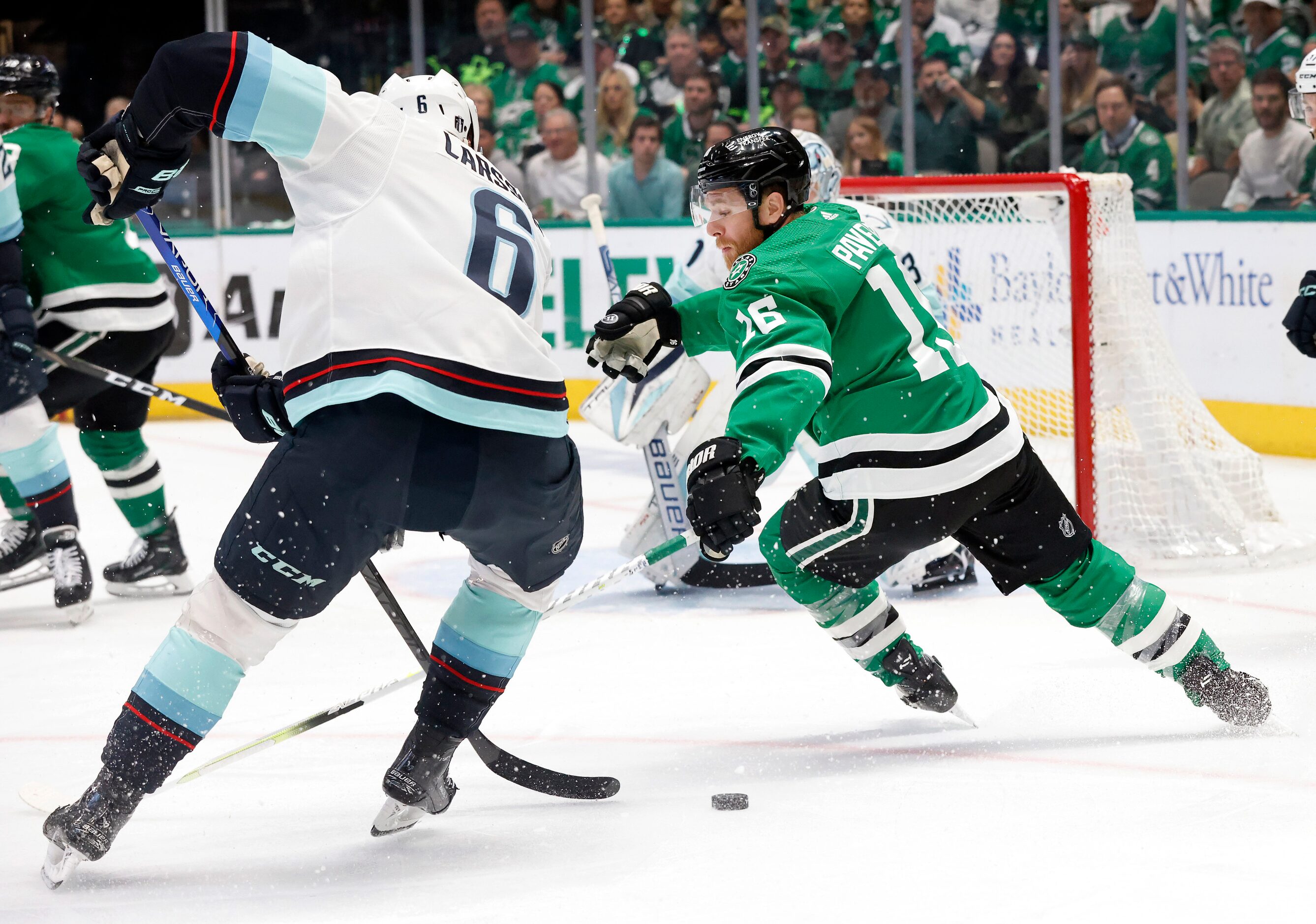 Dallas Stars center Joe Pavelski (16) loses the puck to Seattle Kraken defenseman Adam...