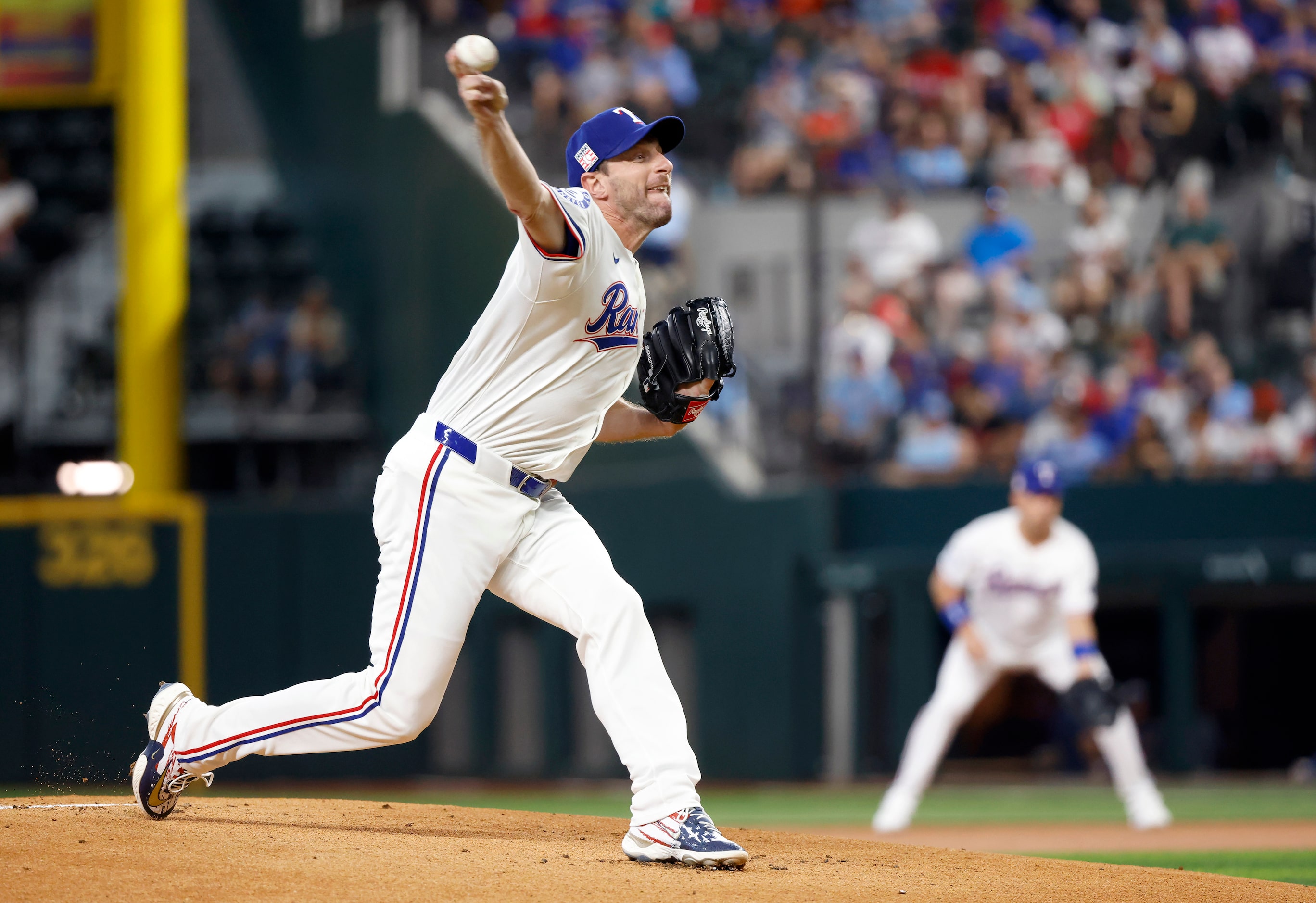 Texas Rangers starting pitcher Max Scherzer throws in the first inning against the Baltimore...