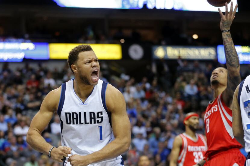 Dallas Mavericks guard Justin Anderson (1) exults after drawing the offensive foul from...