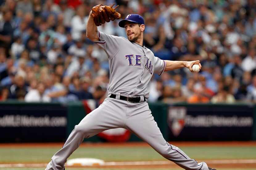 Pitcher Cliff Lee #33 of the Texas Rangers pitches against the Tampa Bay Rays during Game 1...