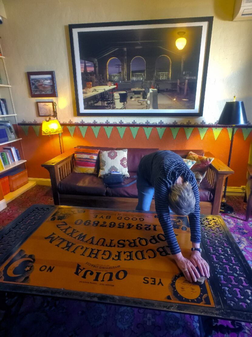 At the haunted Hotel Congress in Tucson, a Ouija board table provides visitors with a...