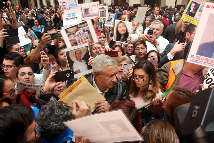 Andrés Manuel López Obrador escucha los reclamos de familiares de personas desaparecidas en...