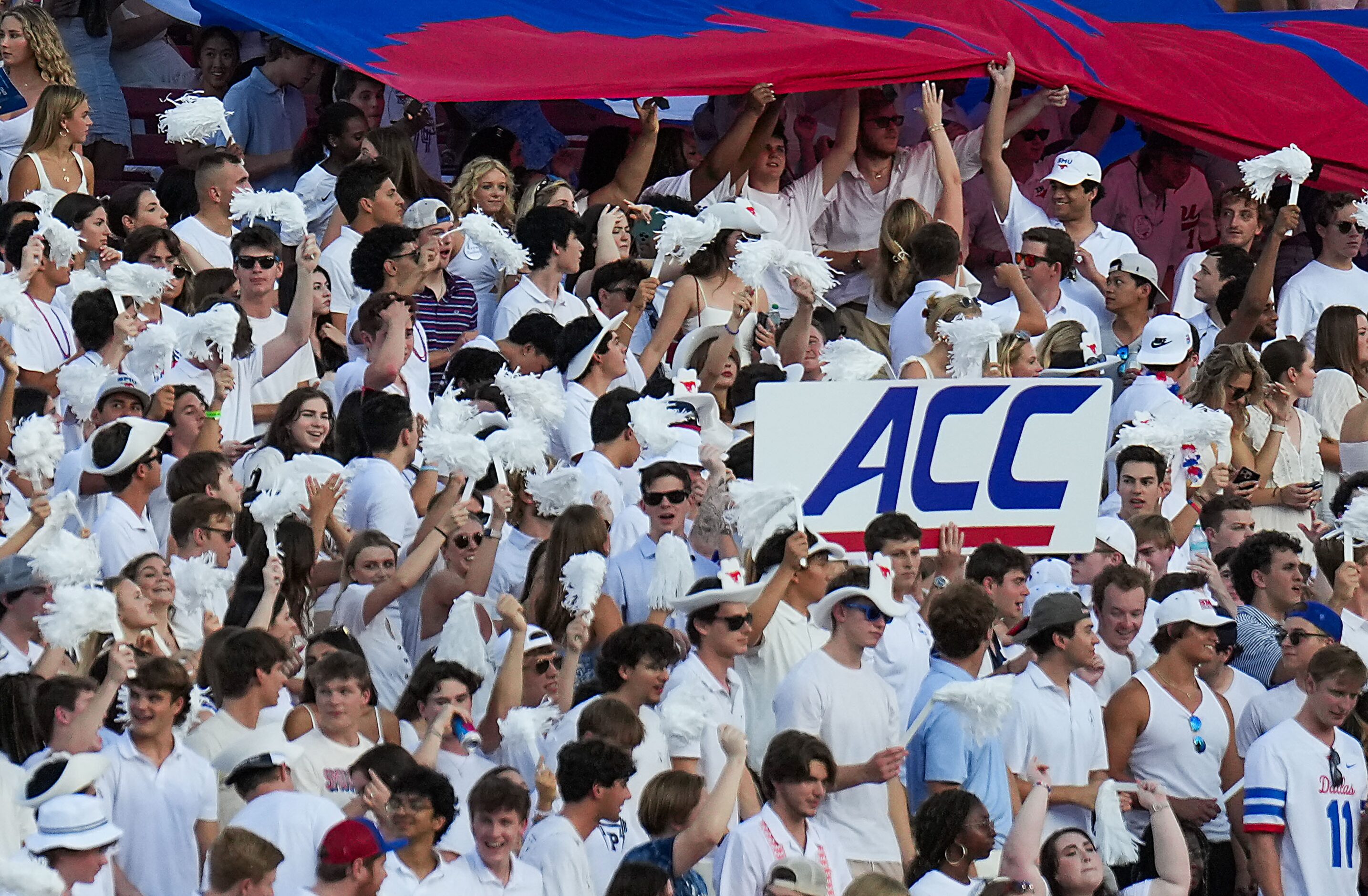 SMU students hold a sign for the ACC during the first half of an NCAA football game against...