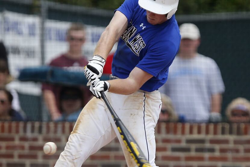 Plano West High School center fielder Billy McKinney (23) makes contact at the plate against...
