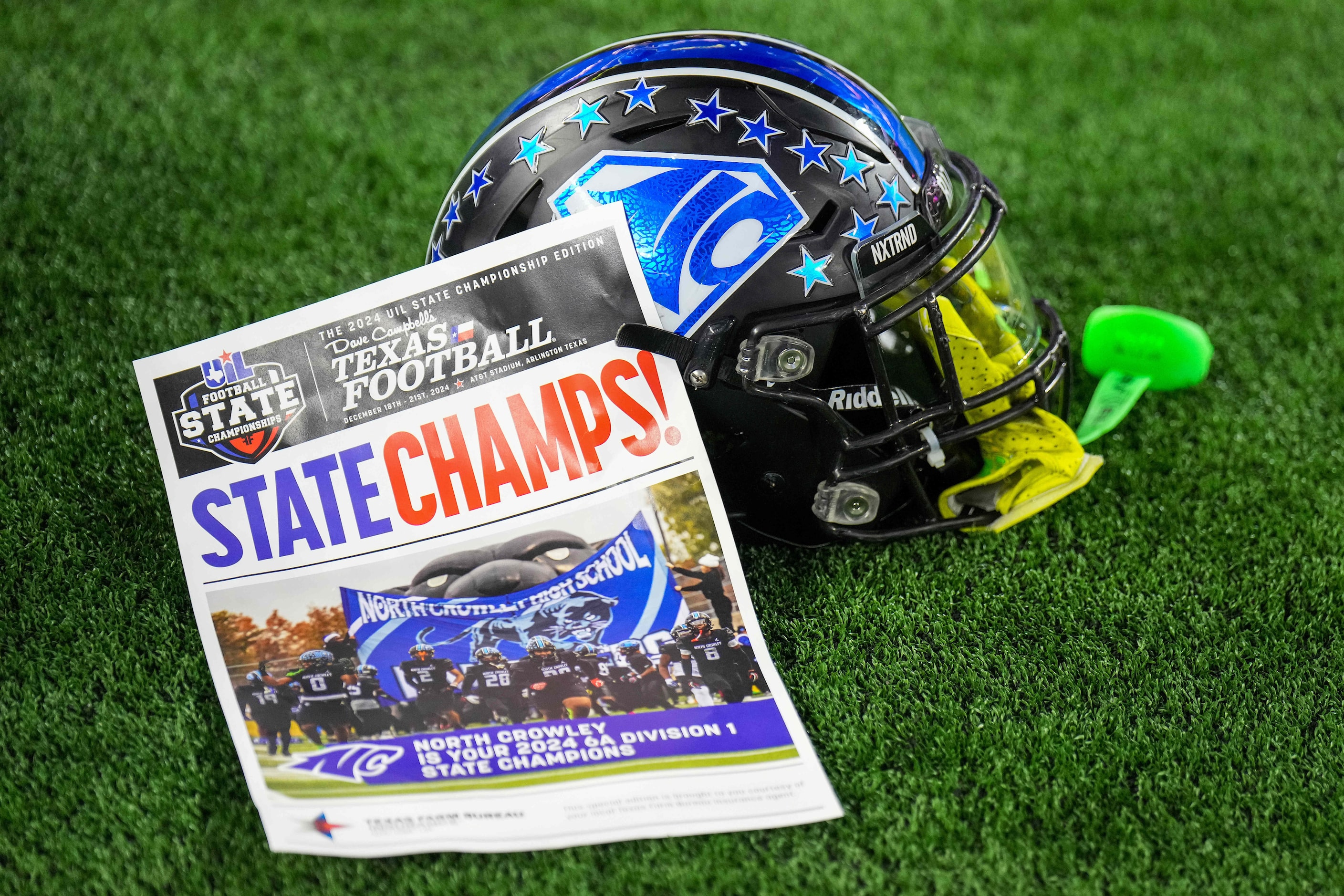 A North Crowley helmet rests on the field after a victory over Austin Westlake in the Class...