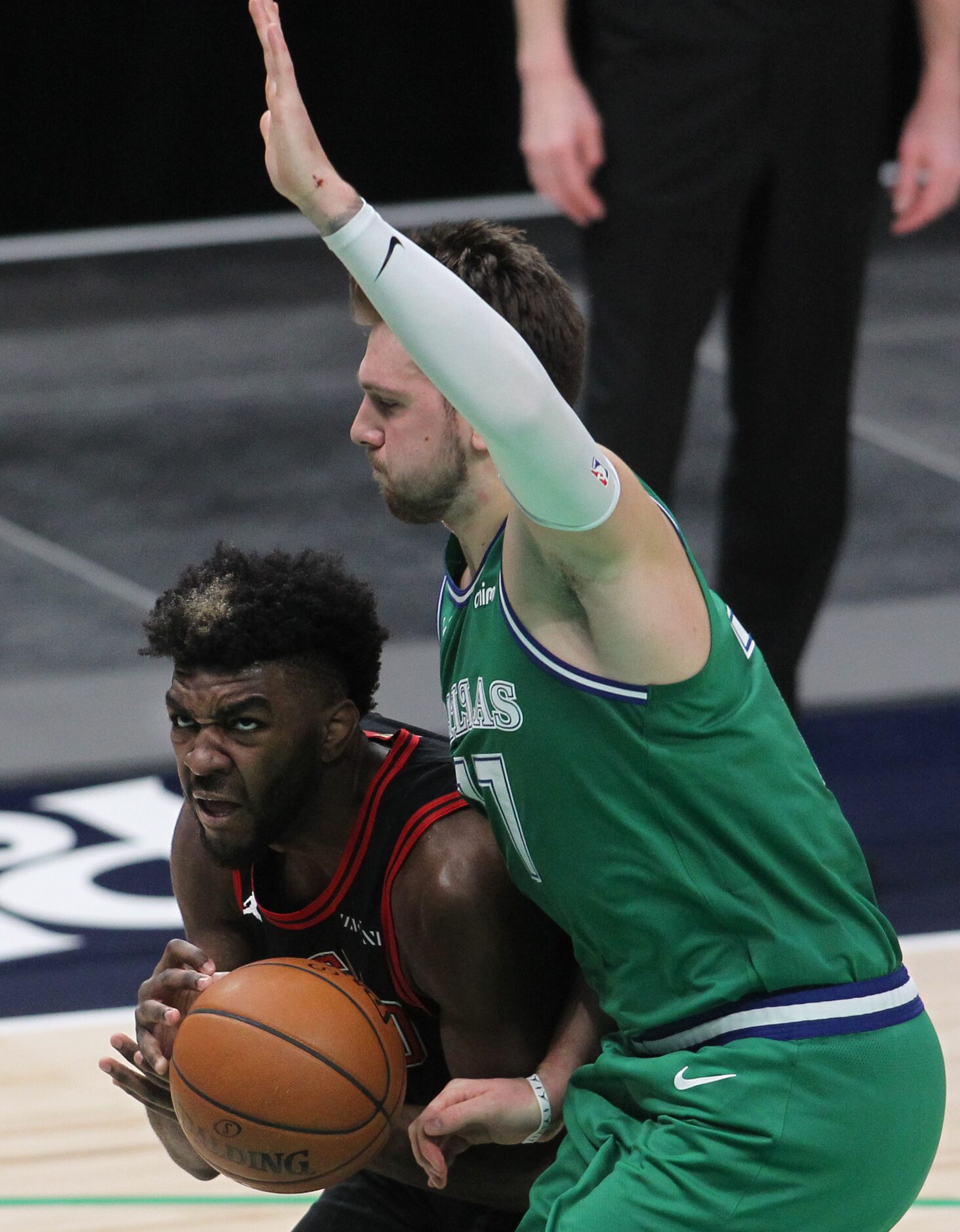 Chicago Bulls forward Patrick Williams (9) attempts to drive against the defense of Dallas...