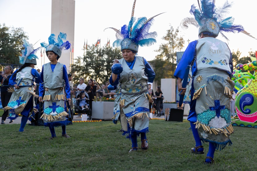 Dancers with the group Danza San Juan Diego perform at the "Mundo Latino" exhibit at the...