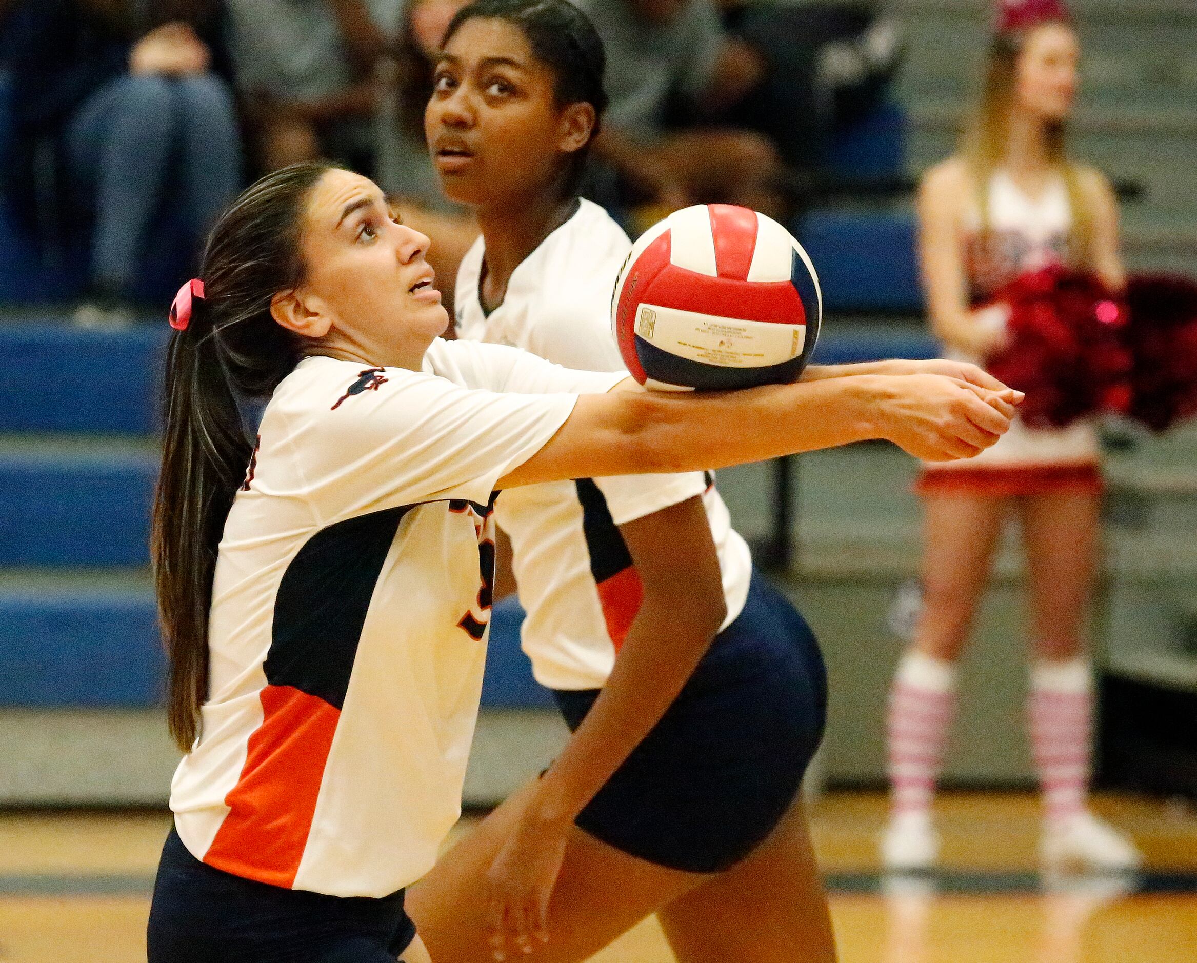 Sachse High School setter Claire Romo (9) makes a bump set during game one as Sachse High...