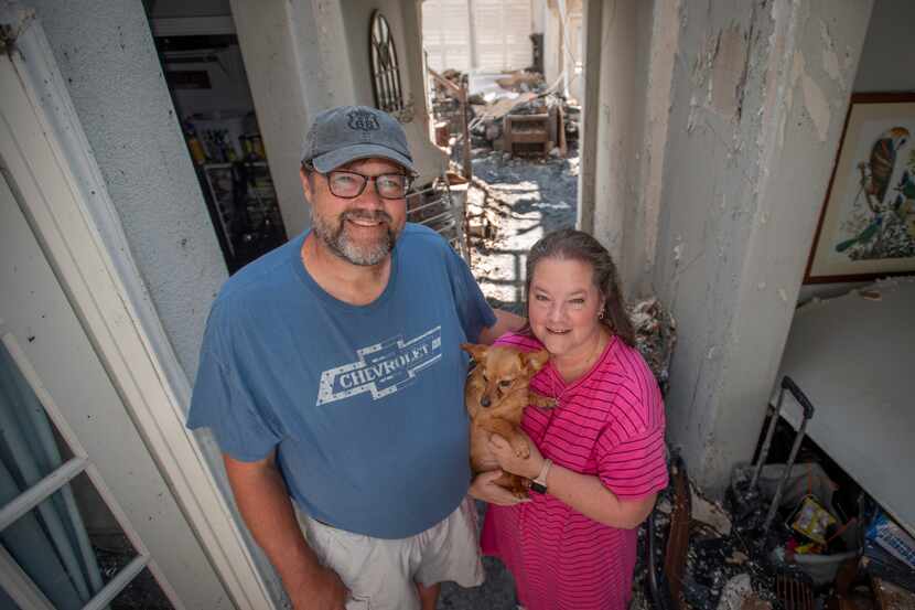 Ron and Gentry King with their dog Ruby who survived a fire Friday evening that destroyed...
