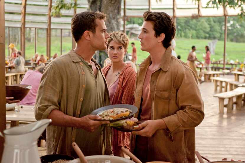 In this image released by Lionsgate, Theo James, from left, Shailene Woodley and Miles...