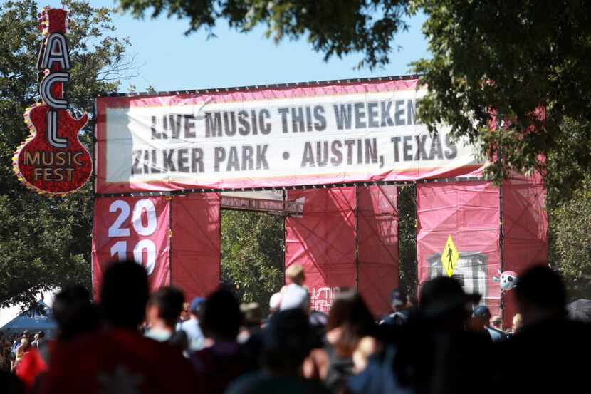 Music fans head towards the main entrance at the Austin City Limits Music Festival in...