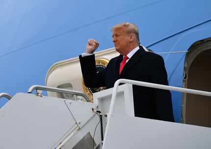 President Donald Trump steps off Air Force One upon arrival in Harlingen on Tuesday, en...