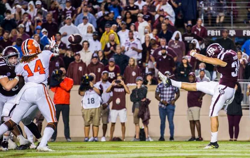 Texas A&M Aggies punter Braden Mann (34) punts the ball at the end of the second quarter...