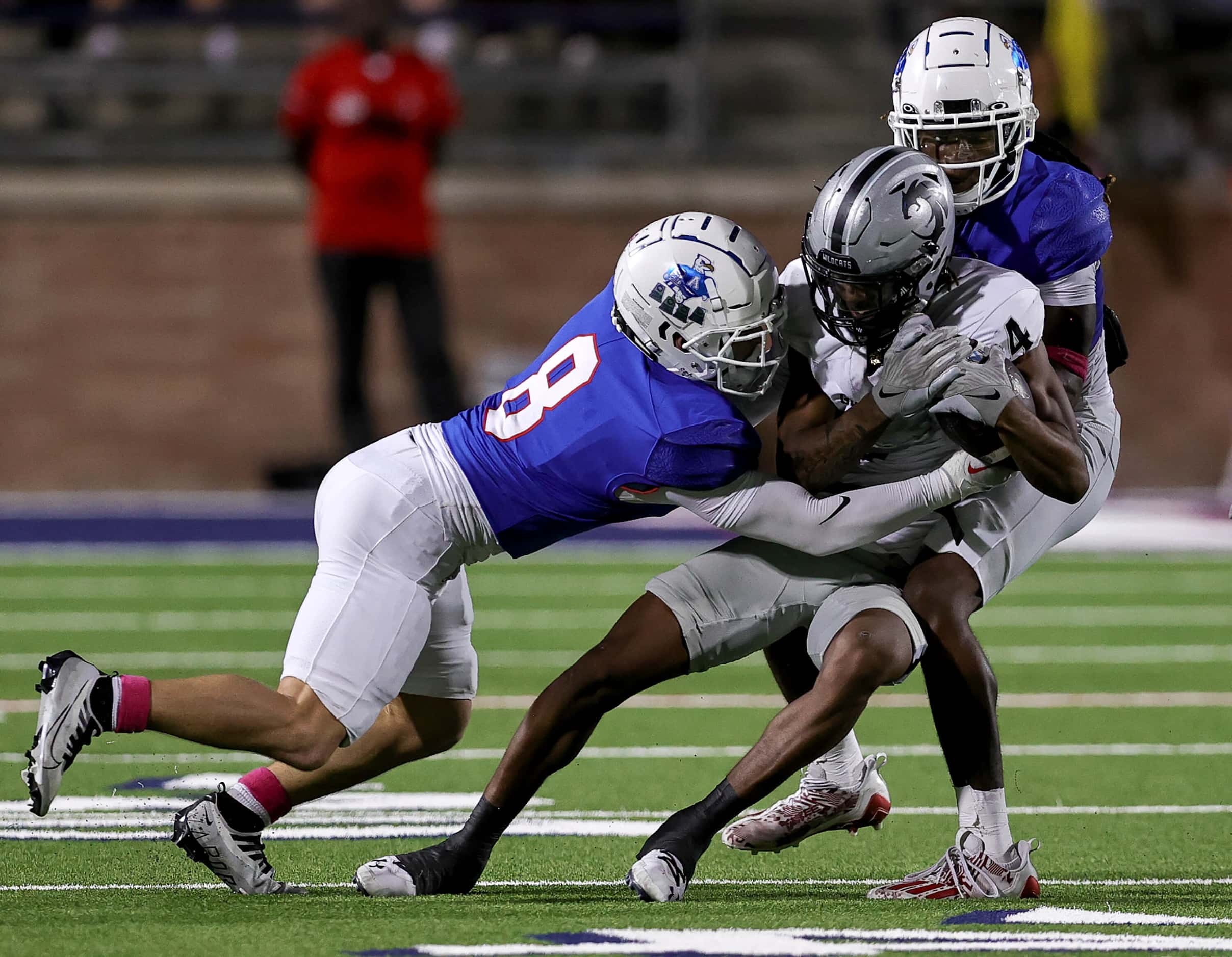 Denton Guyer wide receiver Josiah Martin (4) comes up with recepton and is brought down by...