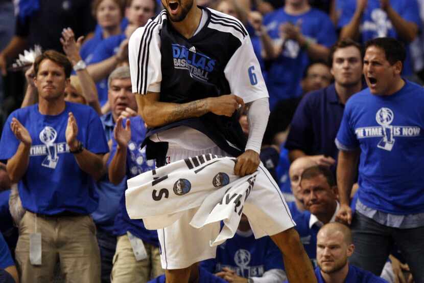 Dallas Mavericks center Tyson Chandler (6) and owner Mark Cuban react during the fourth...