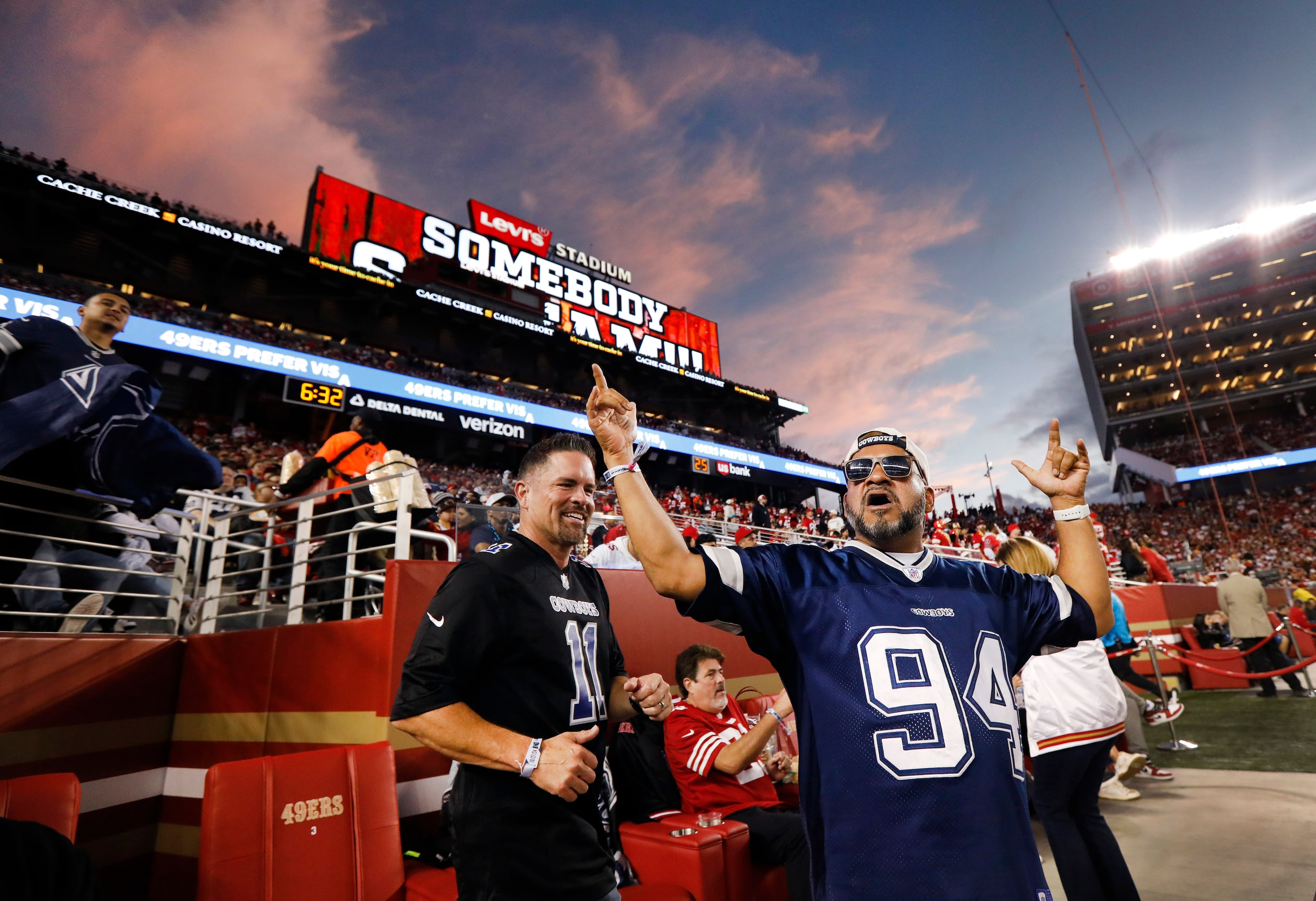 Dallas Cowboys fans Pramod Shintri (right) and David Giambruno of San Jose cheer for their...