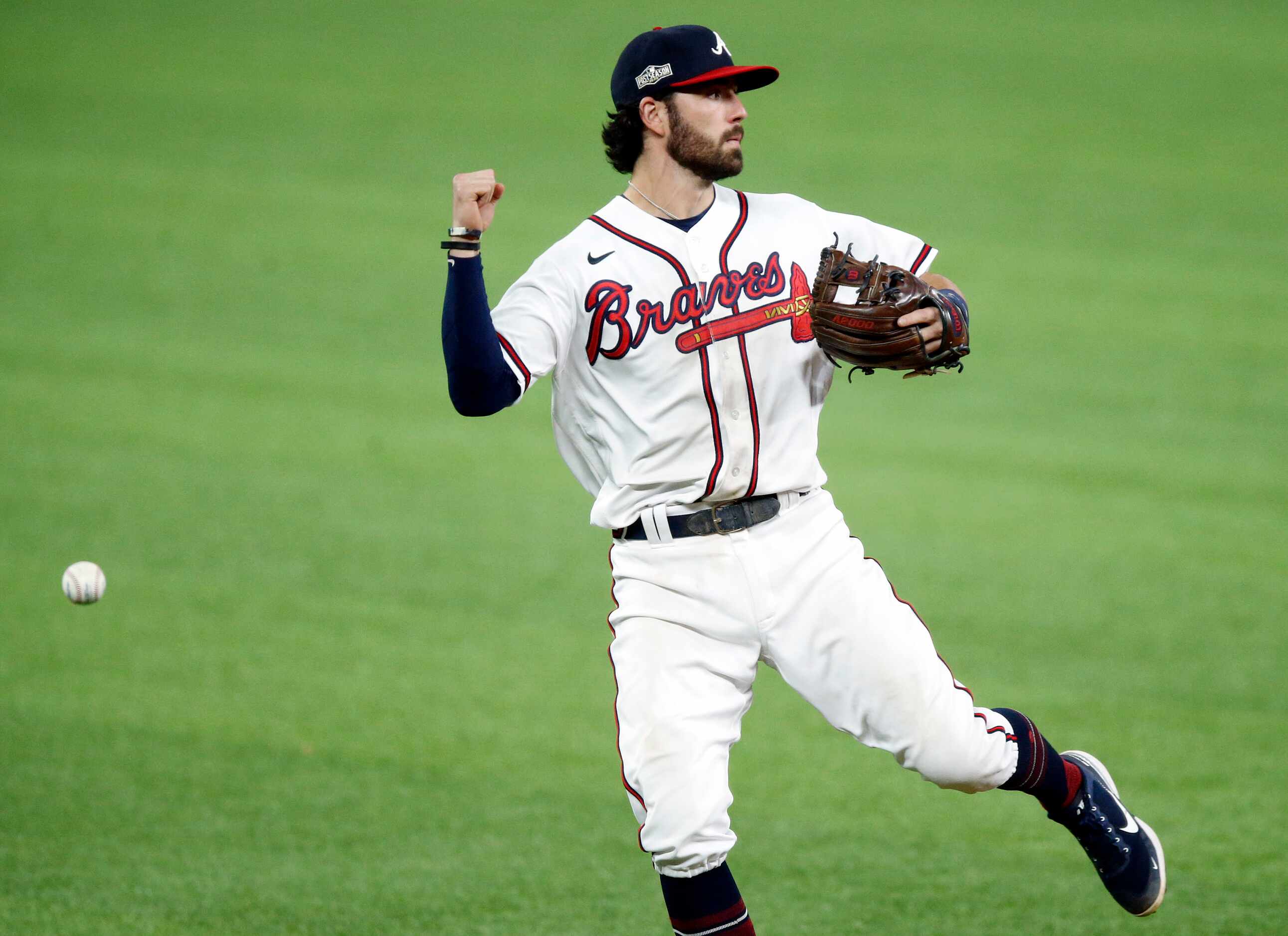 Atlanta Braves shortstop Dansby Swanson (7) misplays a line drive by Los Angeles Dodgers...