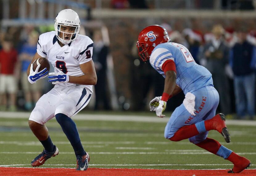 Allen wide receiver Jalen Guyton (9) attempts to avoid a tackle by Skyline defensive back...