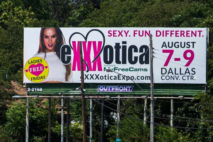 A billboard for the EXXXotica Expo, to be held at the Kay Bailey Hutchison Convention...