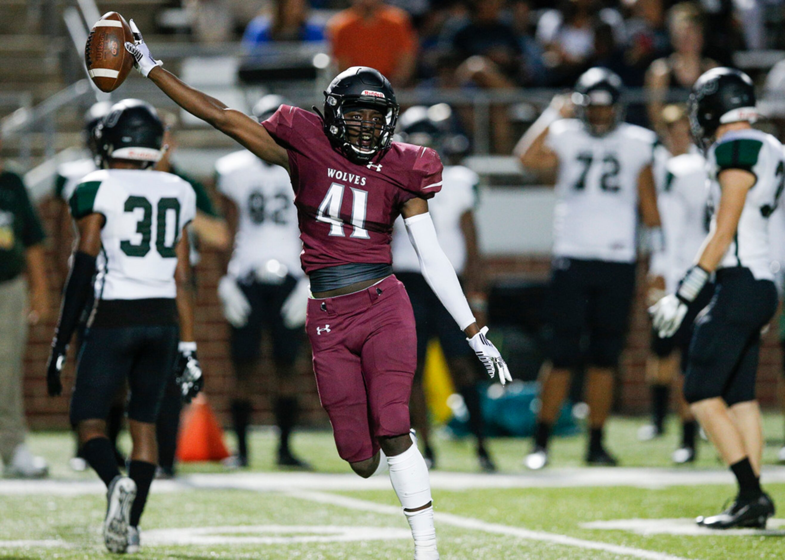 TXHSFB  Mansfield Timberview junior linebacker Kenyata Smith (41) celebrates recovering a...