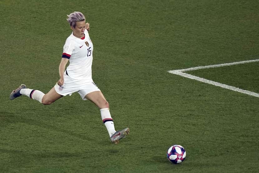 (FILES) In this file photo taken on June 28, 2019, USA forward Megan Rapinoe scores a goal...